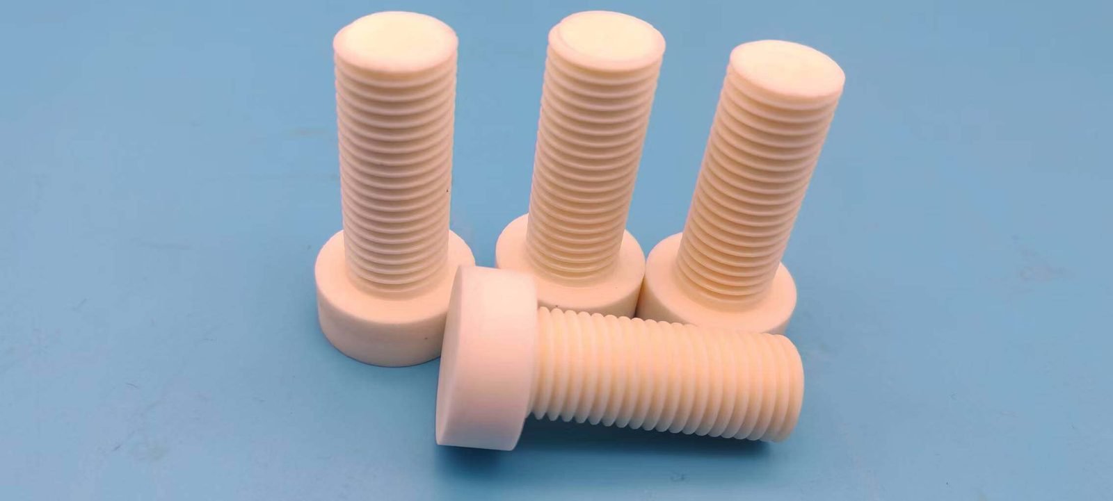 Aluminum nitride ceramic bolts and threaded fasteners