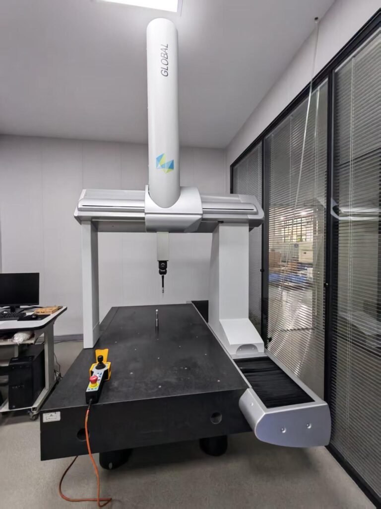 Coordinate measuring machine inspecting a ceramic part in the Korecera inspection room