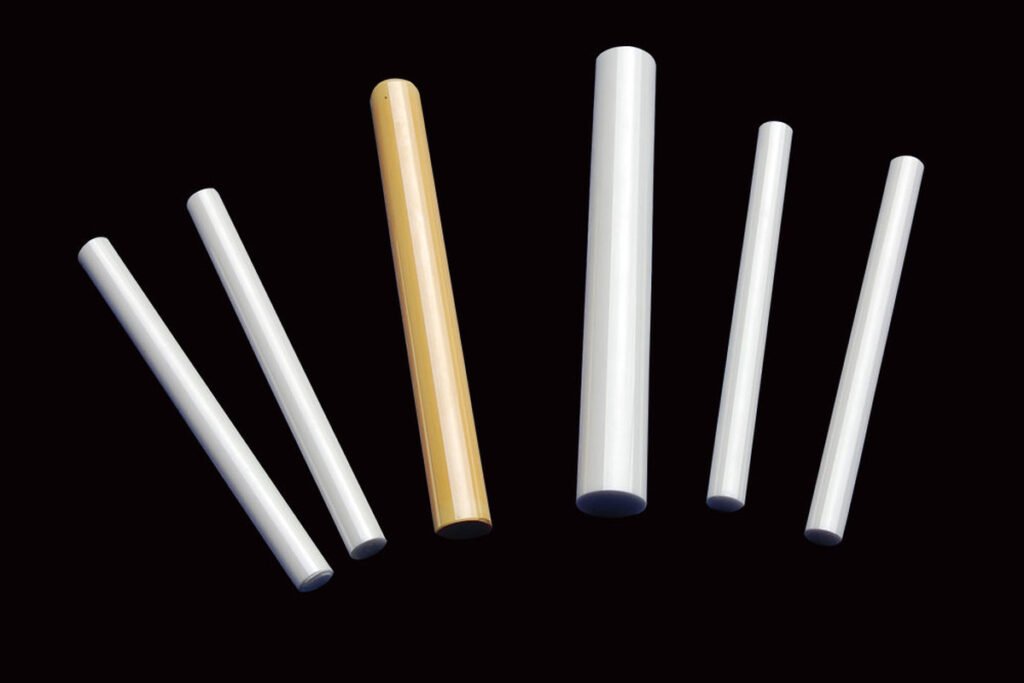 Row of machined zirconia rods from a repeat production run